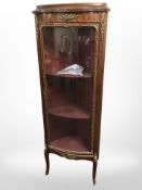 A reproduction continental bow-front corner vitrine,