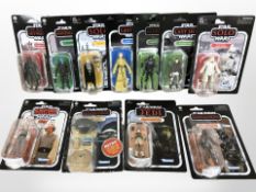 11 Kenner Star Wars figurines including The Mandalorian, The Empire Strikes Back, etc., boxed.