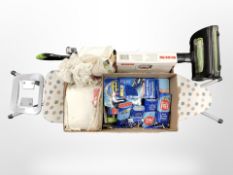 A group of home wares including Gtech upright vacuum cleaner, standard lamp, ironing board, linen,