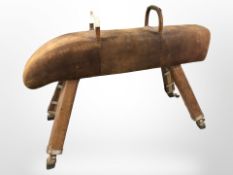 A 20th century pine and stitched leather pommel horse,