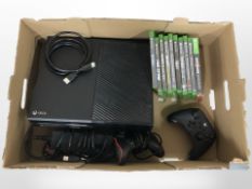 An Xbox One with lead, two controllers, quantity of games.