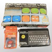 An Itari video computer system, a further Itari Star Raiders with video touch pad,