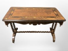 A Victorian walnut and satin wood inlaid occasional table on barley twist supports,