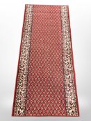 A machine made Persian design runner,
