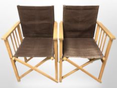 A pair of folding director's style chairs