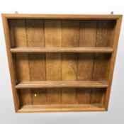 An oak wall shelf,