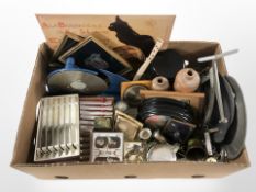 A reproduction French enamelled sign, assorted metal wares, playing cards, cutlery, etc.