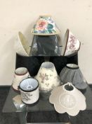 A group of contemporary home wares including lamp shades, two pairs of wrought-metal candle sconces,