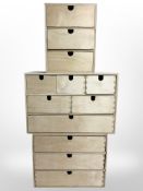 Three plywood multi-drawer chests, largest 42cm wide.