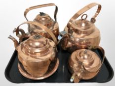Four copper kettles.