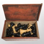 A turned and stained boxwood chess set, kings 7cm.