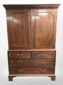 A Regency mahogany linen press by S & H Jewell, 132 High Holborn, London ,
