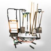 A plastic crate of assorted gardening tools and a sack barrow