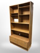 A 20th-century Danish oak veneered open bookcase, 109cm wide x 43cm deep x 195cm high.