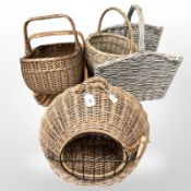 A wicker cat basket, together with a selection of other wicker baskets and log holder.