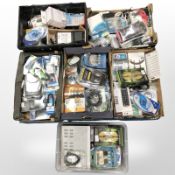 A pallet of ex-retail electricals including optical cables, remote controls,