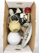 A group of Scandinavian pendant light fittings and table lamps (continental plugs).