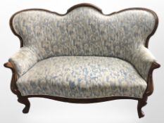 A 19th century continental walnut curved back two seater settee,