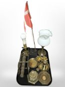 A group of brass dishes, pricket candlestick, two lamp bases, model cannon, desk flagpole, etc.