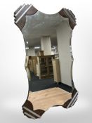 An Art Deco bevelled and chrome-mounted wall mirror, 76cm x 46cm.
