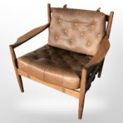 A Danish teak llums Bolighus Copenhagen armchair with button tan leather cushions,