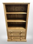 A contemporary pine open bookcase, 81cm wide x 48cm deep x 153cm high.