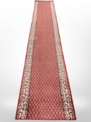 A machine made Persian design runner,