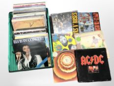 A collection of vinyl LP records including AC/DC, Elton John, Stevie Wonder, Gun 'n' Roses,