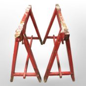 A pair of painted pine X-frame trestle table stands