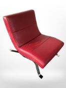 A contemporary Danish chrome and red stitched leather easy chair,