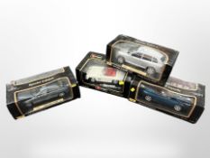 Three Maisto 1:18 scale die-cast vehicles, and a further Burago vehicle.