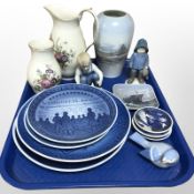 A Royal Copenhagen porcelain jug and similar vase, another vase on blue ground,