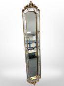 A reproduction Venetian-style gilt and etched wall mirror, 115cm x 21cm.