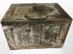An early-19th century cast-iron strongbox, with two-division interior with original working key,