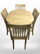 A contemporary pine oval extending dining table with internal leaf, 105cm long unextended,