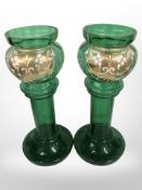 A pair of antique enamelled green glass hyacinth vases, height 22.5cm.
