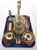 Two teak barometers, a brass menorah and lamp bases, clock under dome.