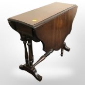 A reproduction mahogany drop leaf occasional table,