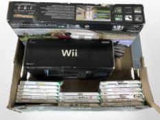A Nintendo Wii console, a quantity of games, together with a golf simulator launch pad.