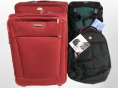 Two Samsonite luggage cases, a Wenger backpack, and a further backpack.