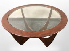 A G-Plan circular teak coffee table with glass inset top,