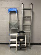 Two aluminium step ladders and a further folding step