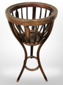 A beech jardiniere stand,