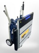 A Ryobi ETS-1825 folding table saw with manual