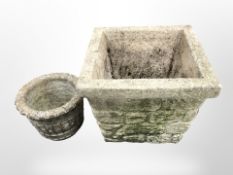 Four concrete garden planters,
