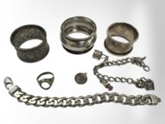 A silver curb link bracelet, a silver napkin ring and two plated examples, charm bracelet, etc.