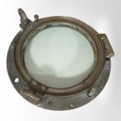 A brass porthole window,