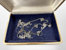 A group of silver dress rings, pendants, necklace chains, etc.