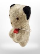 A vintage novelty sewing tape measure in the form of Sooty, height 9.5cm.