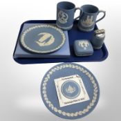 Two Wedgwood blue and white Jasperware Christmas plates, pair of tankards, a table lighter,
